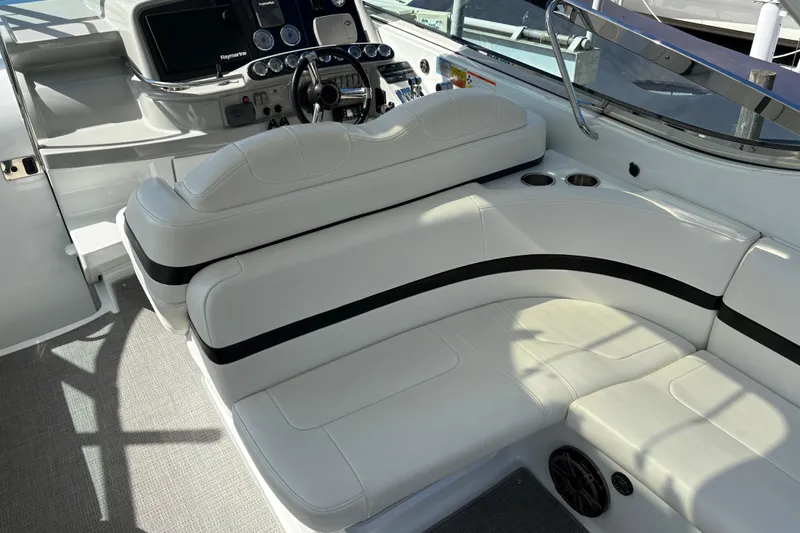  Yacht Photos Pics Interior of a 2007 Formula 400 Super Sport boat with white seating and control panel.