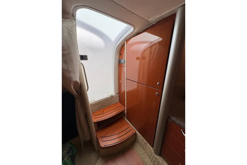  Yacht Photos Pics Interior of 2007 Formula 400 Super Sport yacht with wooden cabinetry and steps.