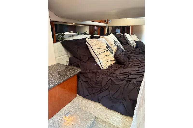  Yacht Photos Pics Luxurious cabin interior of 2007 Formula 400 Super Sport with plush bedding and decorative pillows.