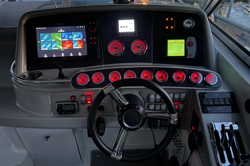  Yacht Photos Pics Dashboard of a 2007 Formula 400 Super Sport boat with illuminated gauges and controls.