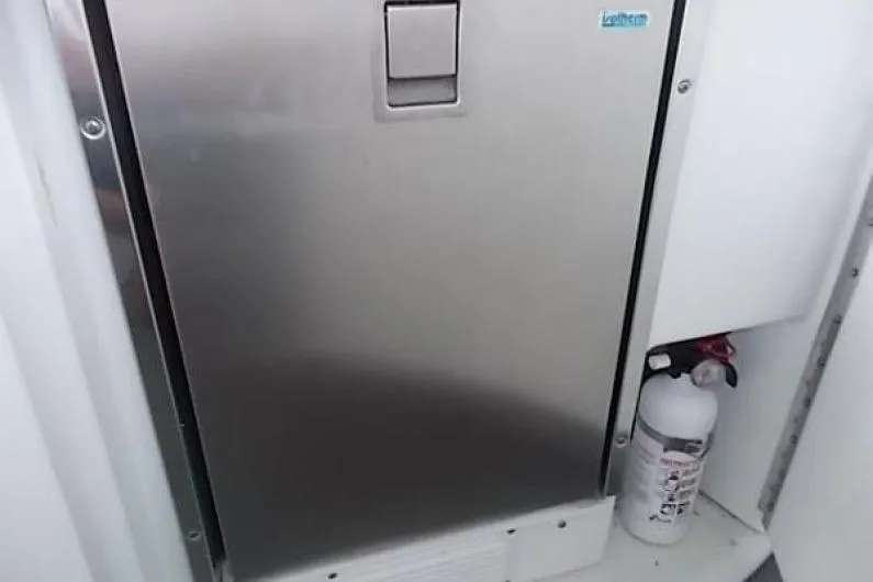  Yacht Photos Pics Stainless steel door on 2007 Formula 400 Super Sport boat with fire extinguisher nearby.