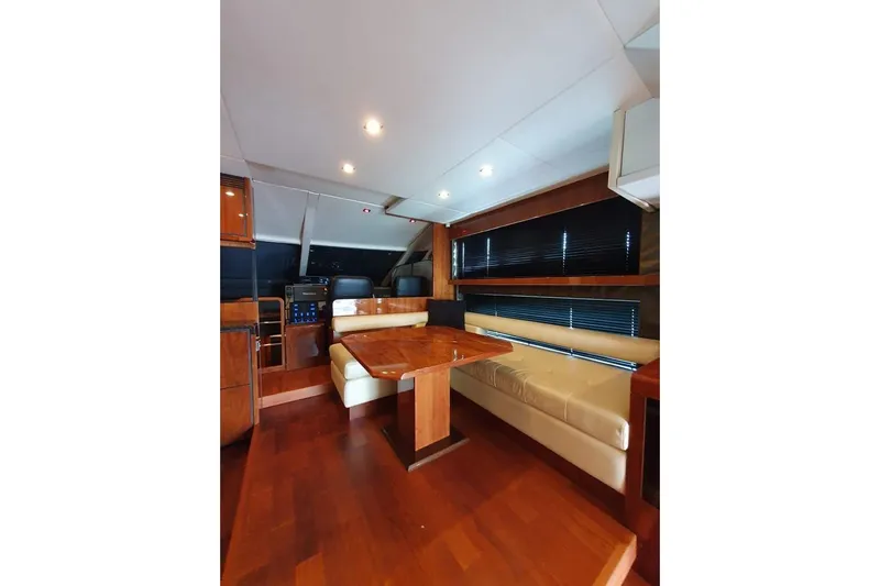 Kamats Yacht Photos Pics Luxurious interior of 2010 Fairline Squadron 55 yacht with wooden flooring and seating area.