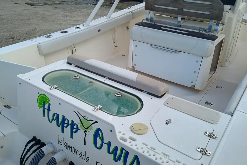 S28-117 Brokerage Joe Yacht Photos Pics 2010 Pursuit S 280 Sport boat interior with seating and storage compartments.