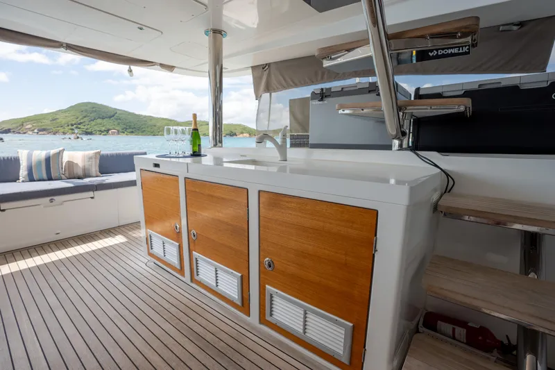  Yacht Photos Pics Luxurious Lagoon 620 yacht interior with wooden cabinetry and scenic ocean view, 2014 model.