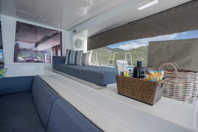  Yacht Photos Pics Interior of 2014 Lagoon 620 yacht with comfortable seating and scenic window view.