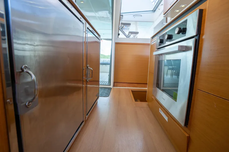  Yacht Photos Pics Modern kitchen interior of 2014 Lagoon 620 yacht with stainless steel appliances.