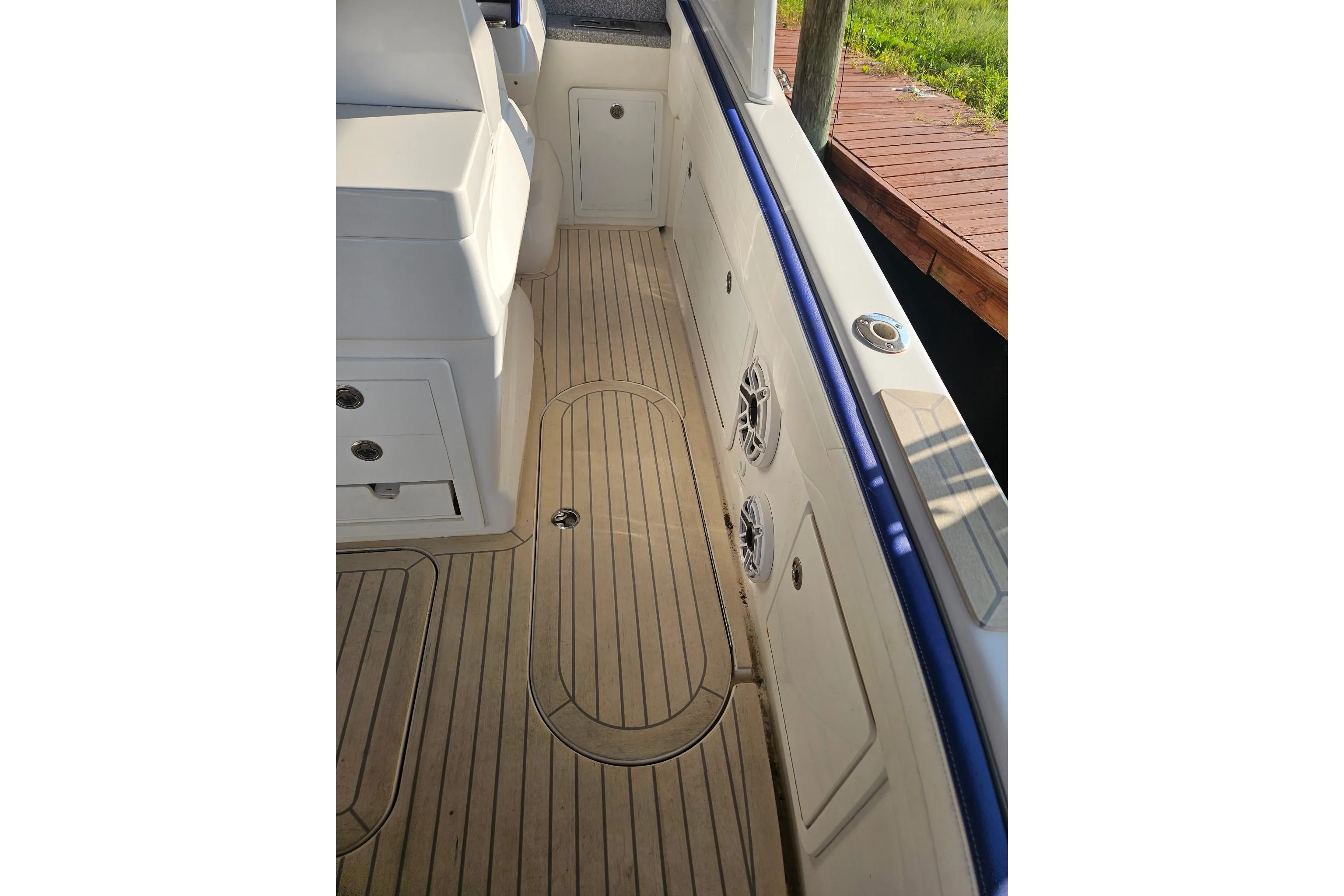 2019 Concept 44' Cuddy Cabin boat interior with sleek wooden flooring and white cabinetry.