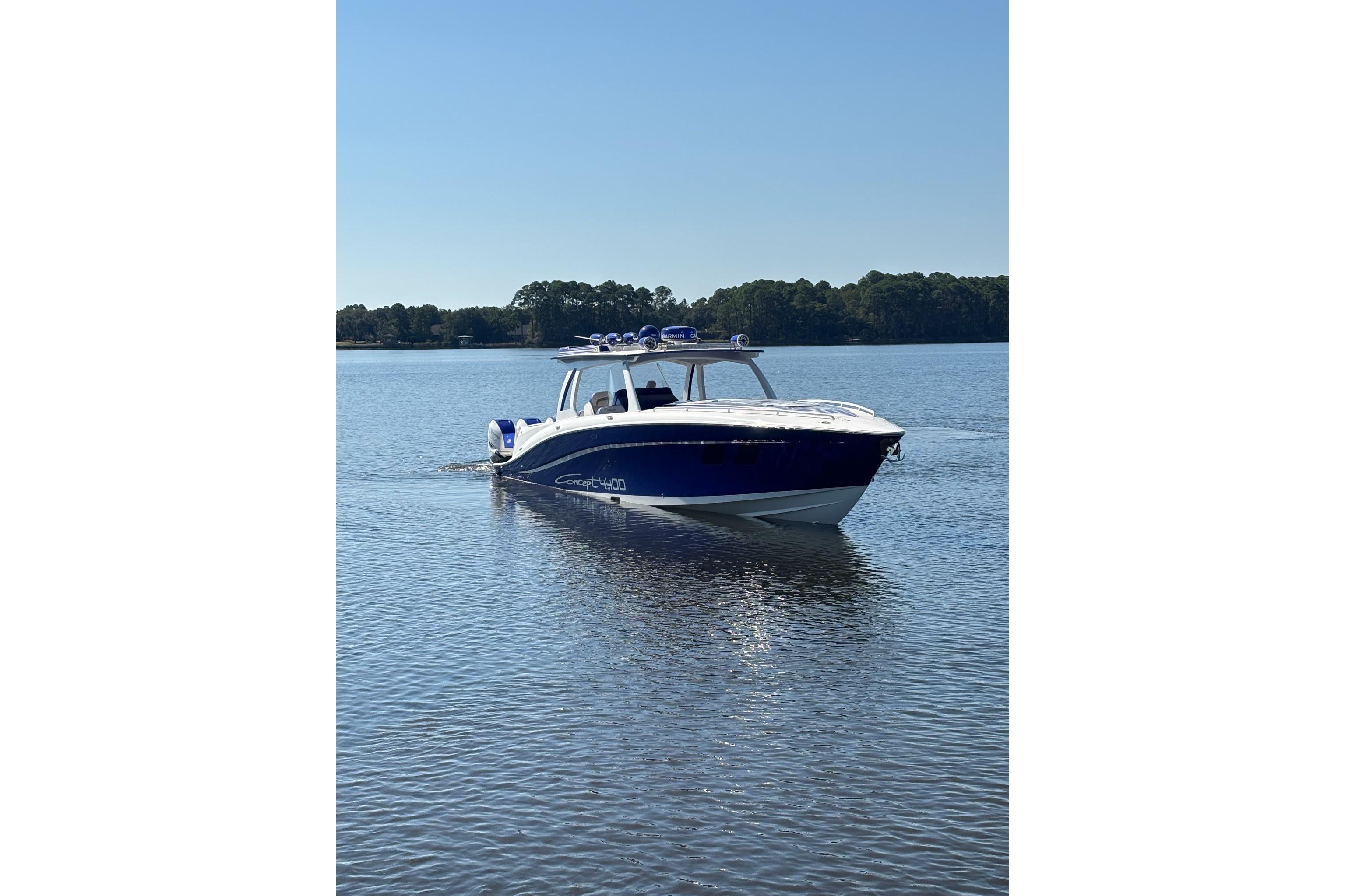 2019 Concept 44' Cuddy Cabin boat cruising on a calm lake.