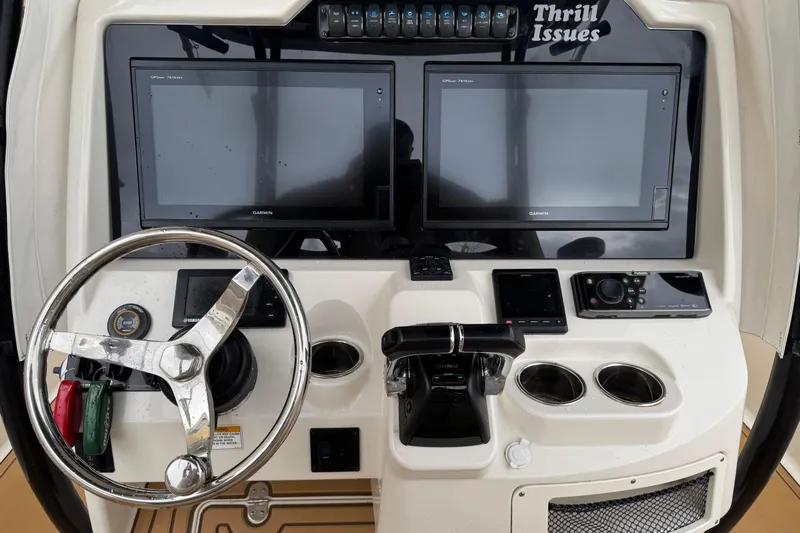  Yacht Photos Pics Control panel of a 2015 Sailfish 320 CC boat with dual Garmin screens.