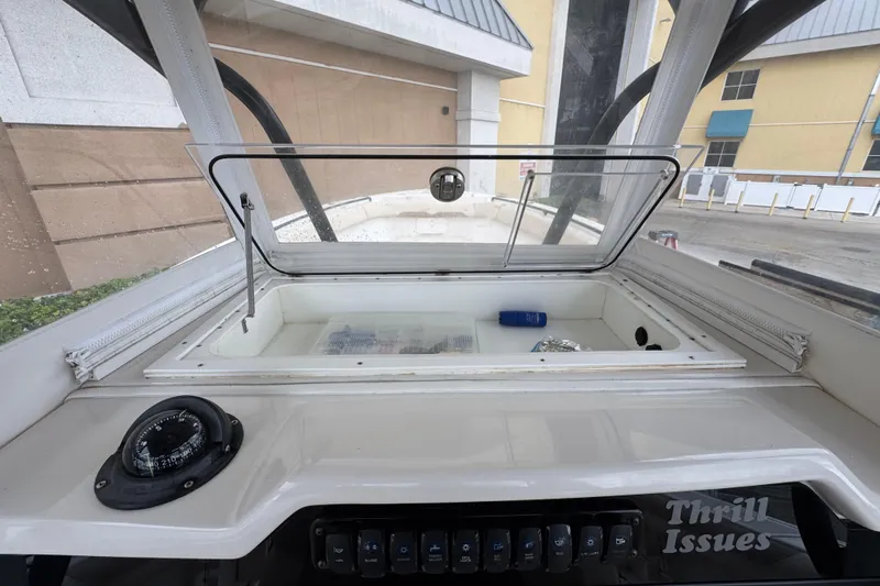  Yacht Photos Pics Interior view of a 2015 Sailfish 320 CC boat console with storage compartment.