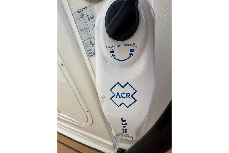  Yacht Photos Pics EPIRB device on 2015 Sailfish 320 CC boat, featuring ACR logo and lock mechanism.