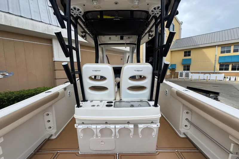  Yacht Photos Pics 2015 Sailfish 320 CC boat interior with dual seats and fishing rod holders.