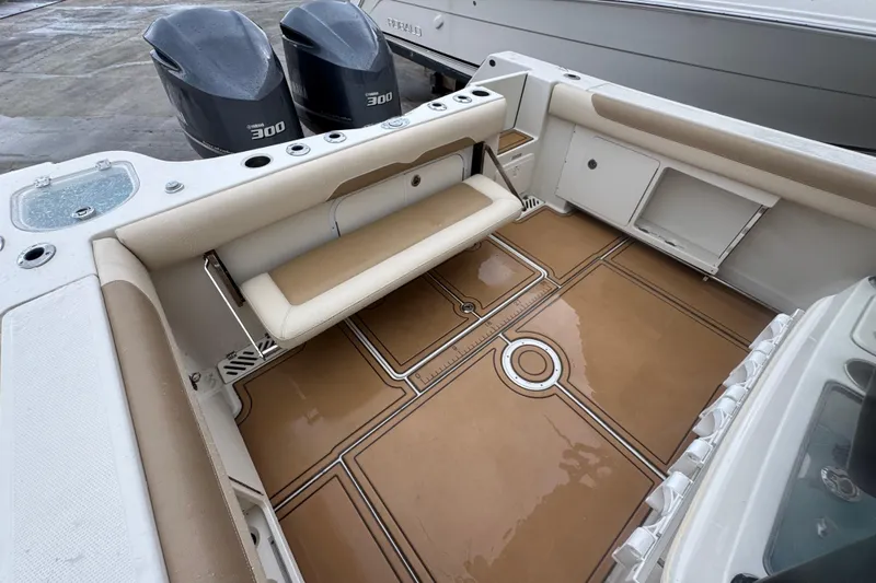  Yacht Photos Pics 2015 Sailfish 320 CC boat interior with foldable seat and twin Yamaha 300 engines.