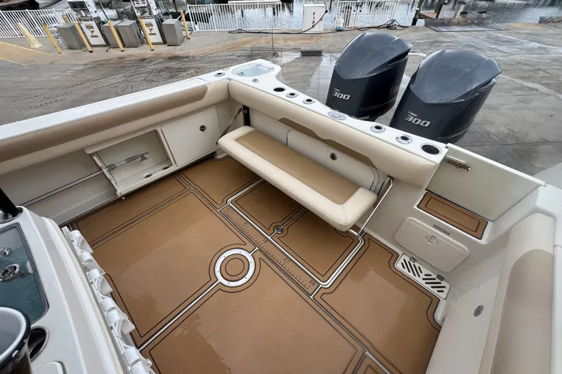  Yacht Photos Pics 2015 Sailfish 320 CC boat interior with seating and twin outboard engines.