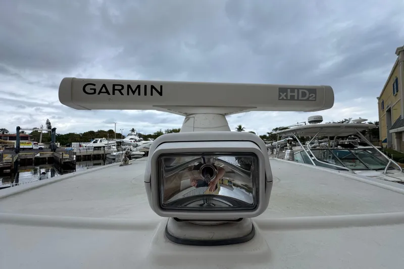  Yacht Photos Pics Garmin xHD2 radar on 2015 Sailfish 320 CC boat, docked under cloudy skies.