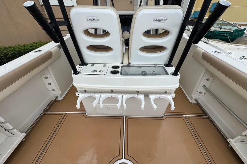  Yacht Photos Pics 2015 Sailfish 320 CC boat interior with rod holders and seating.