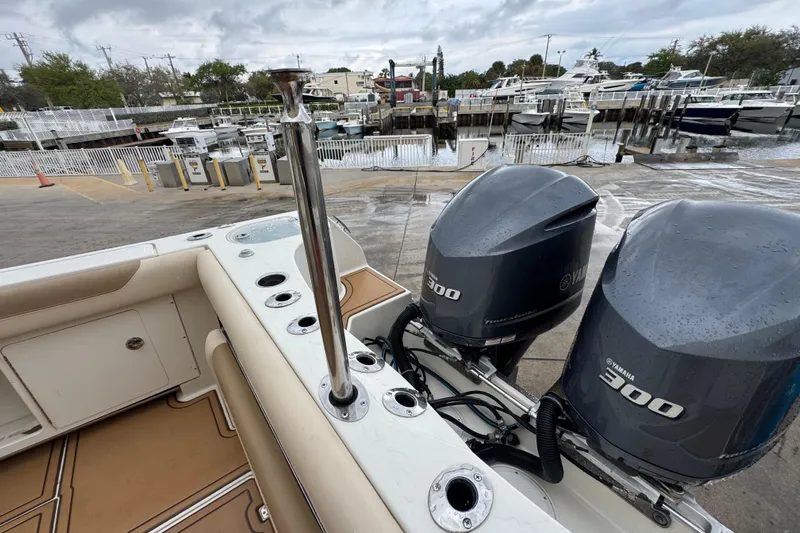  Yacht Photos Pics 2015 Sailfish 320 CC boat with twin Yamaha 300 engines at a marina dock.