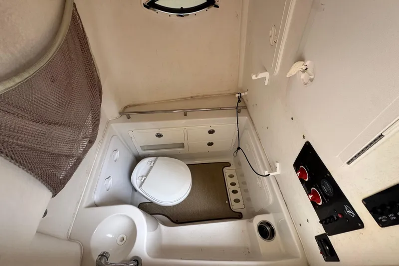  Yacht Photos Pics Interior of 2015 Sailfish 320 CC featuring toilet and sink.