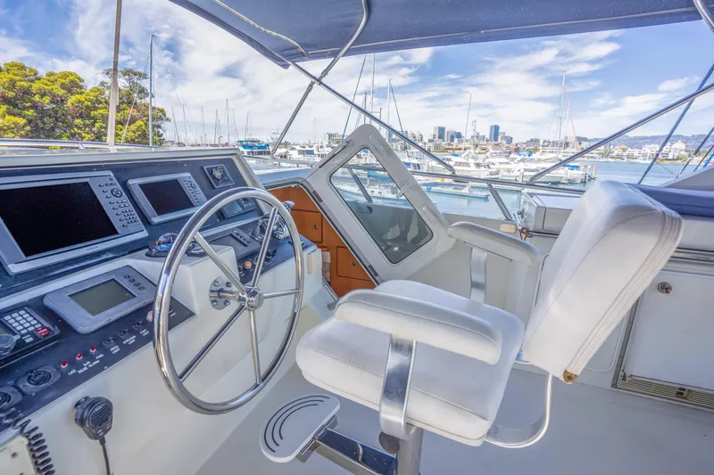 Yachtmaster Yacht Photos Pics Helm of a 2002 Symbol 58 yacht docked in marina.