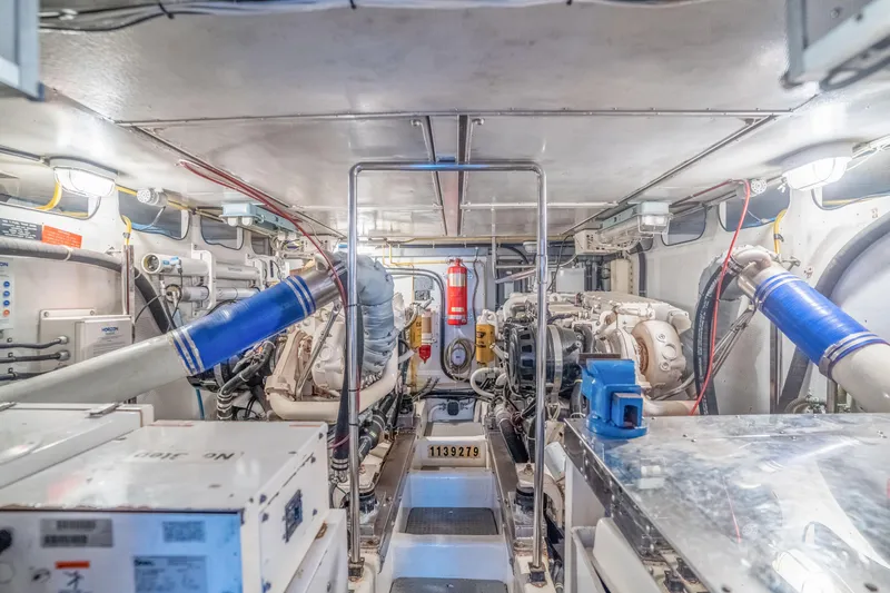 Yachtmaster Yacht Photos Pics Engine room of a 2002 Symbol 58 with machinery and equipment.