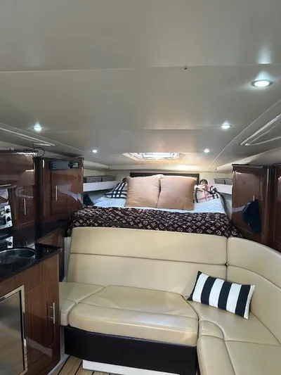  Yacht Photos Pics Interior of 2013 Regal 35 Sport Coupe with cozy seating and bed area.