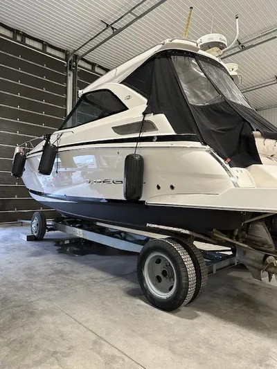  Yacht Photos Pics 2013 Regal 35 Sport Coupe boat on trailer in garage.