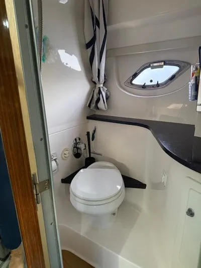  Yacht Photos Pics 2013 Regal 35 Sport Coupe bathroom with toilet, window, and countertop.