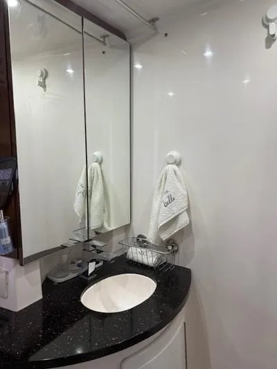  Yacht Photos Pics Bathroom interior of 2013 Regal 35 Sport Coupe with mirror and sink.