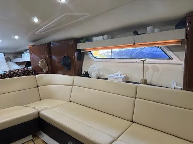  Yacht Photos Pics Interior of 2013 Regal 35 Sport Coupe with beige seating and modern decor.