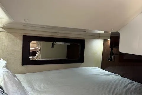  Yacht Photos Pics Interior cabin of 2013 Regal 35 Sport Coupe with bed and window.