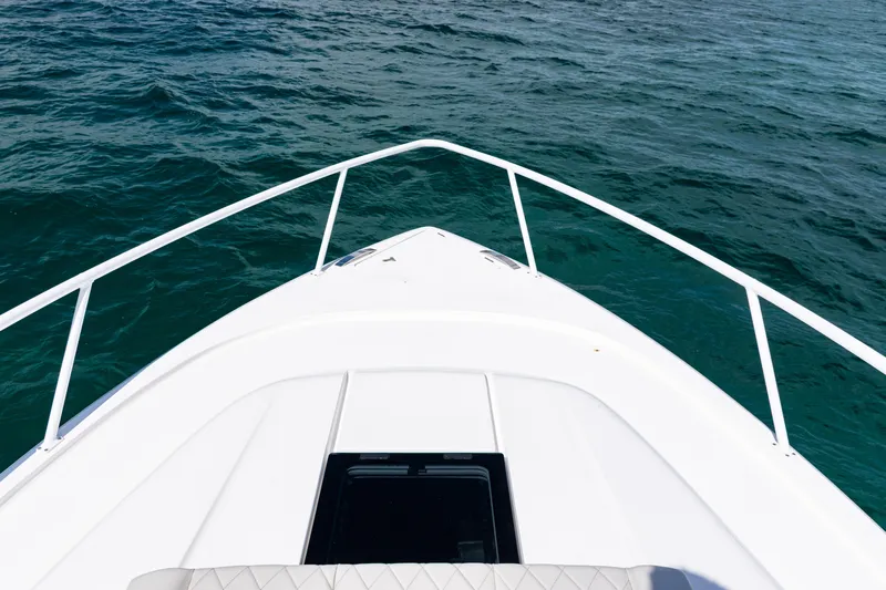  Yacht Photos Pics Bow view of 2018 Intrepid 438 Evolution yacht on open water.