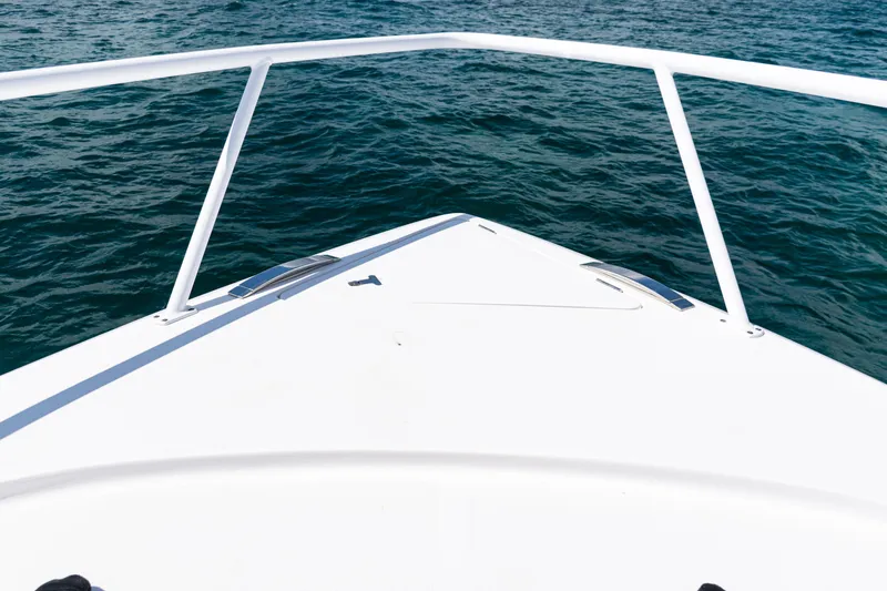  Yacht Photos Pics Bow view of 2018 Intrepid 438 Evolution yacht on open water.