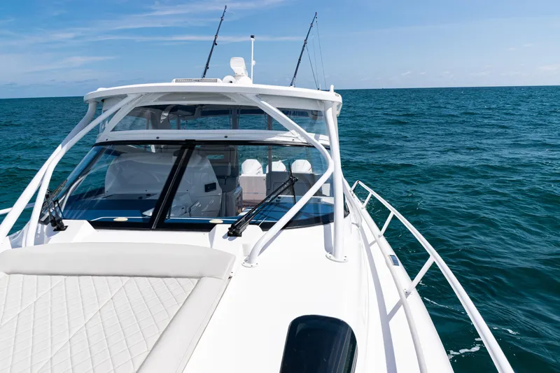  Yacht Photos Pics 2018 Intrepid 438 Evolution yacht cruising on open sea under clear skies.