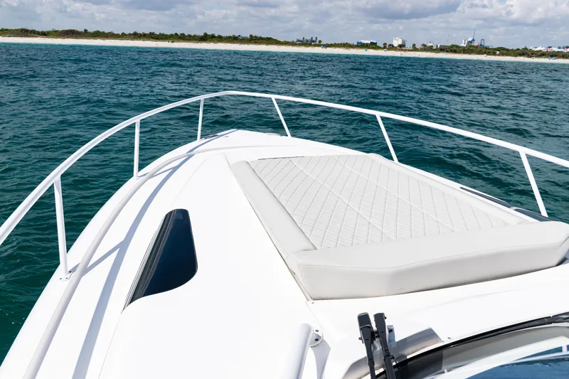  Yacht Photos Pics Bow view of 2018 Intrepid 438 Evolution yacht on open water.