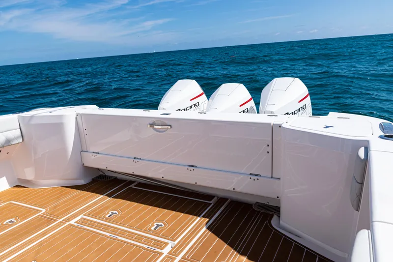  Yacht Photos Pics 2018 Intrepid 438 Evolution boat with triple outboard engines on open sea.