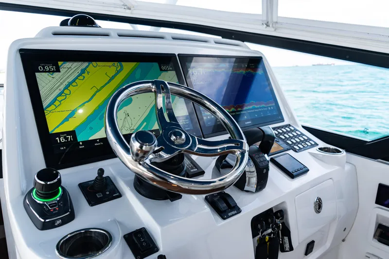  Yacht Photos Pics Cockpit of 2018 Intrepid 438 Evolution with advanced navigation displays and steering wheel.