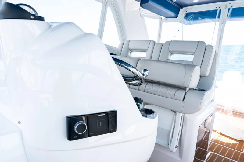  Yacht Photos Pics 2018 Intrepid 438 Evolution yacht interior with sleek helm and luxurious seating.