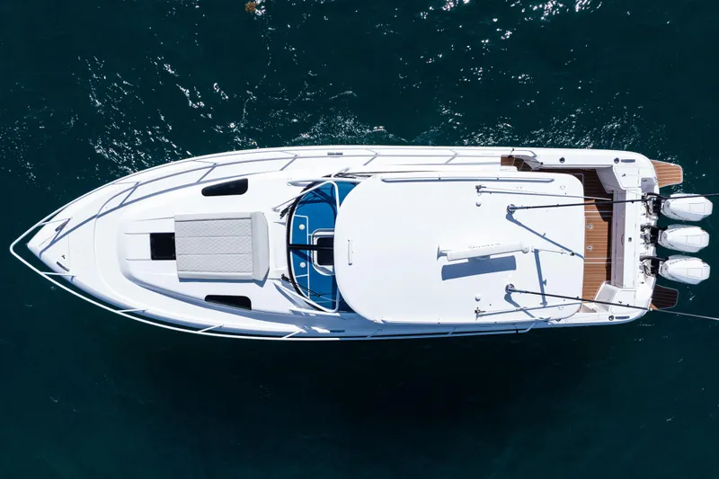  Yacht Photos Pics Aerial view of 2018 Intrepid 438 Evolution yacht on blue water.
