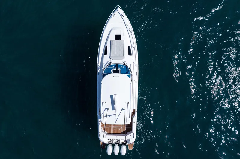  Yacht Photos Pics Overhead view of 2018 Intrepid 438 Evolution yacht on blue ocean water.