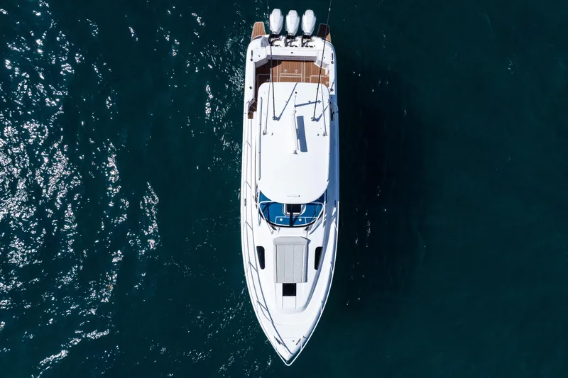  Yacht Photos Pics Overhead view of 2018 Intrepid 438 Evolution yacht on deep blue water.