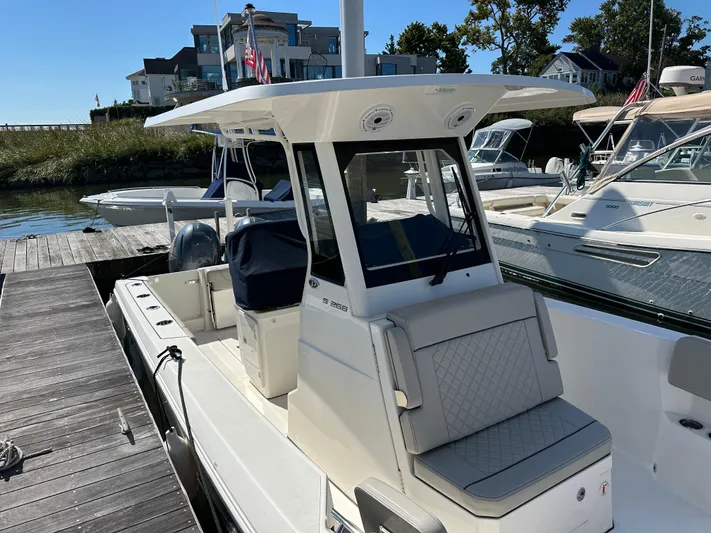  Yacht Photos Pics 2024 Pursuit S 268 boat docked, featuring a sleek design and modern amenities.