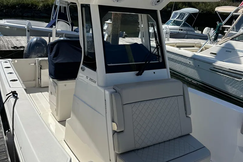  Yacht Photos Pics 2024 Pursuit S 268 boat with sleek design and comfortable seating.