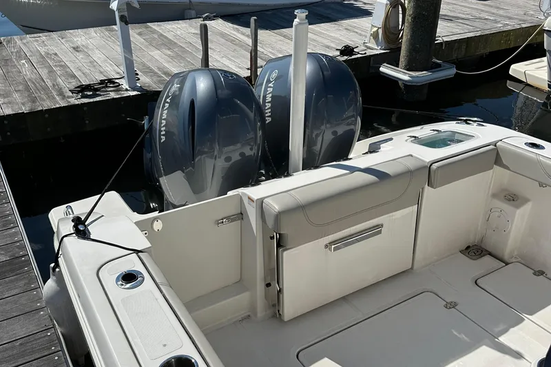  Yacht Photos Pics 2024 Pursuit S 268 boat with dual Yamaha outboard engines docked at marina.