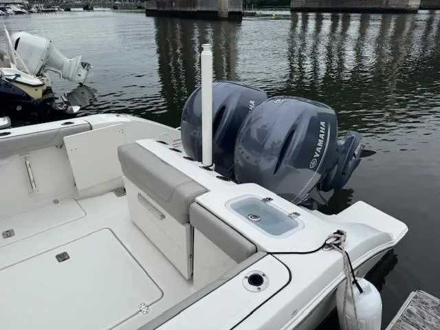  Yacht Photos Pics 2024 Pursuit S 268 boat with dual Yamaha engines docked by the water.