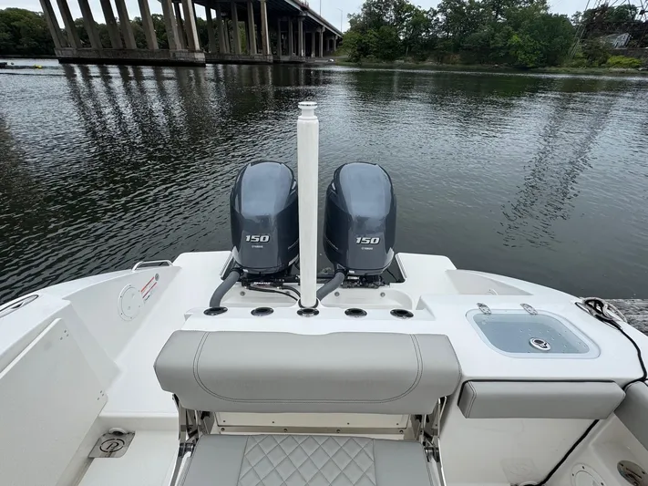  Yacht Photos Pics 2024 Pursuit S 268 boat with dual 150 engines on a calm river.
