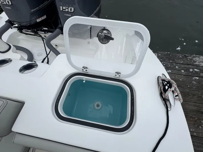  Yacht Photos Pics 2024 Pursuit S 268 boat with open livewell and dual outboard motors.