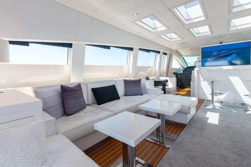Venture Yacht Photos Pics Luxurious interior of 2007 Leopard Cantiere Navale Arno yacht with modern seating and large windows.
