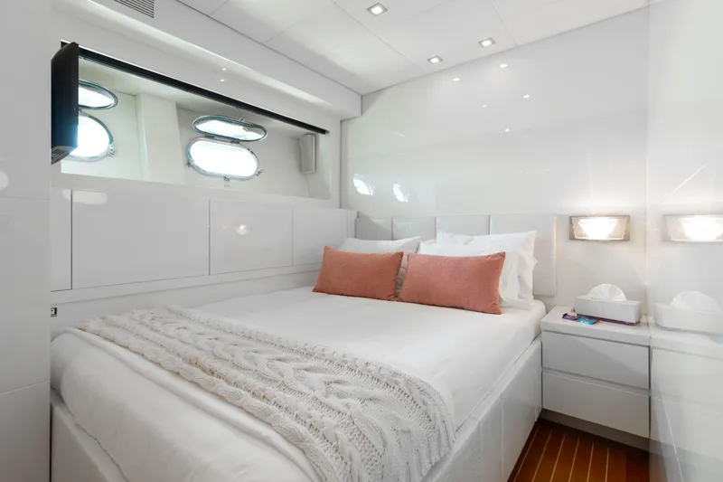 Venture Yacht Photos Pics Luxurious yacht bedroom with white decor, pink cushions, and porthole windows, Leopard Cantiere Navale Arno SpA 2007.