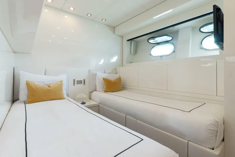 Venture Yacht Photos Pics Luxurious twin cabin on 2007 Leopard yacht, featuring modern design and porthole windows.