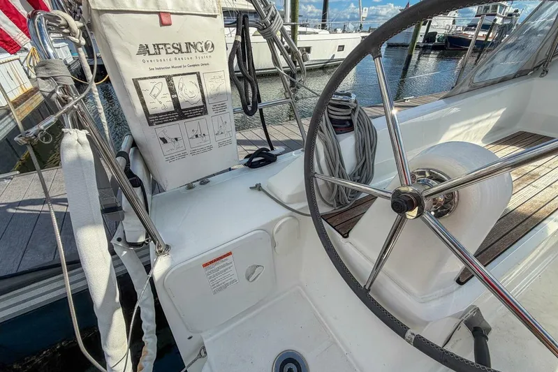 Coastal Distancing Yacht Photos Pics Beneteau Oceanis 30.1 yacht cockpit with steering wheel and Lifesling rescue system, 2021 model.